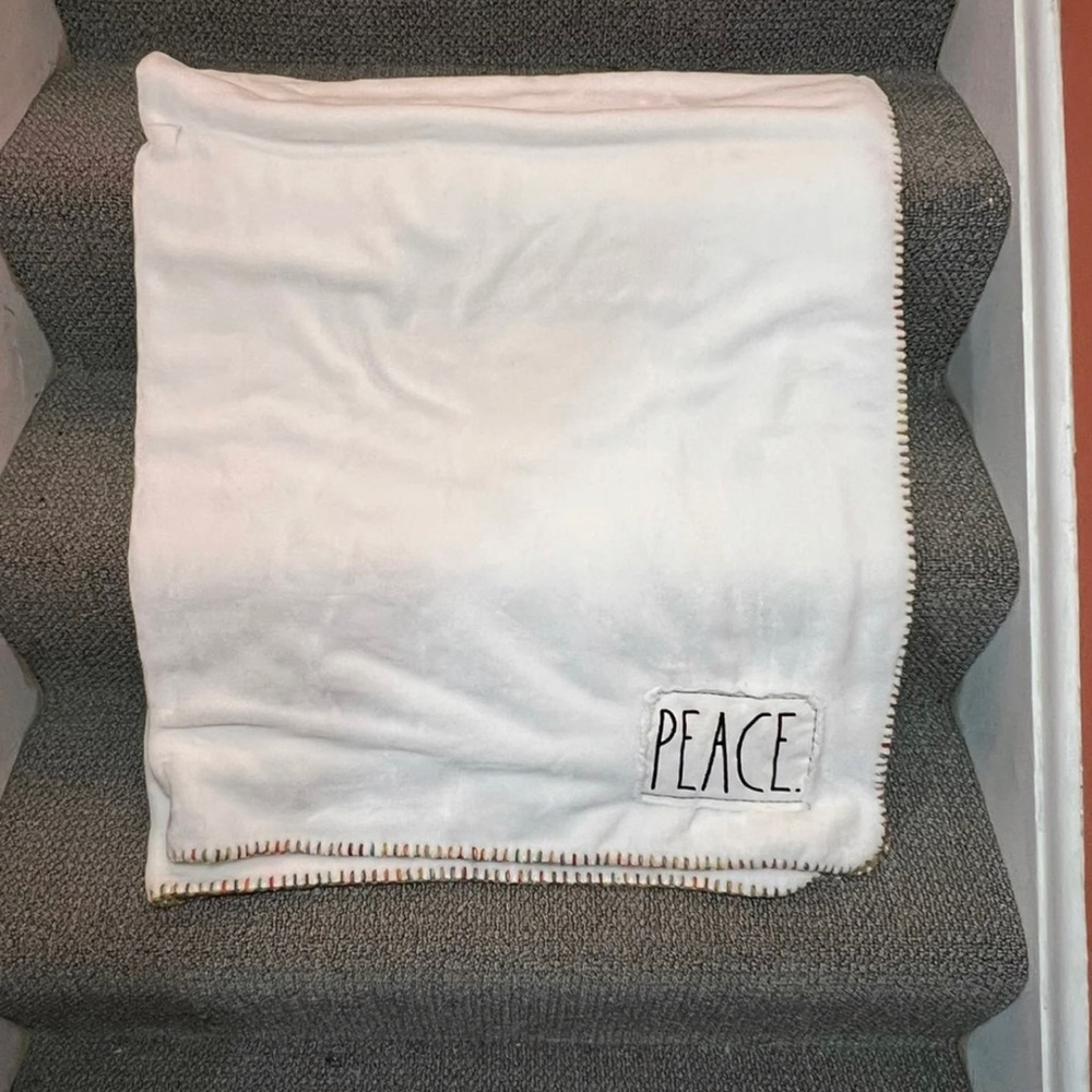 Rae Dunn Peace Blanket With Rainbow Threading On Edge